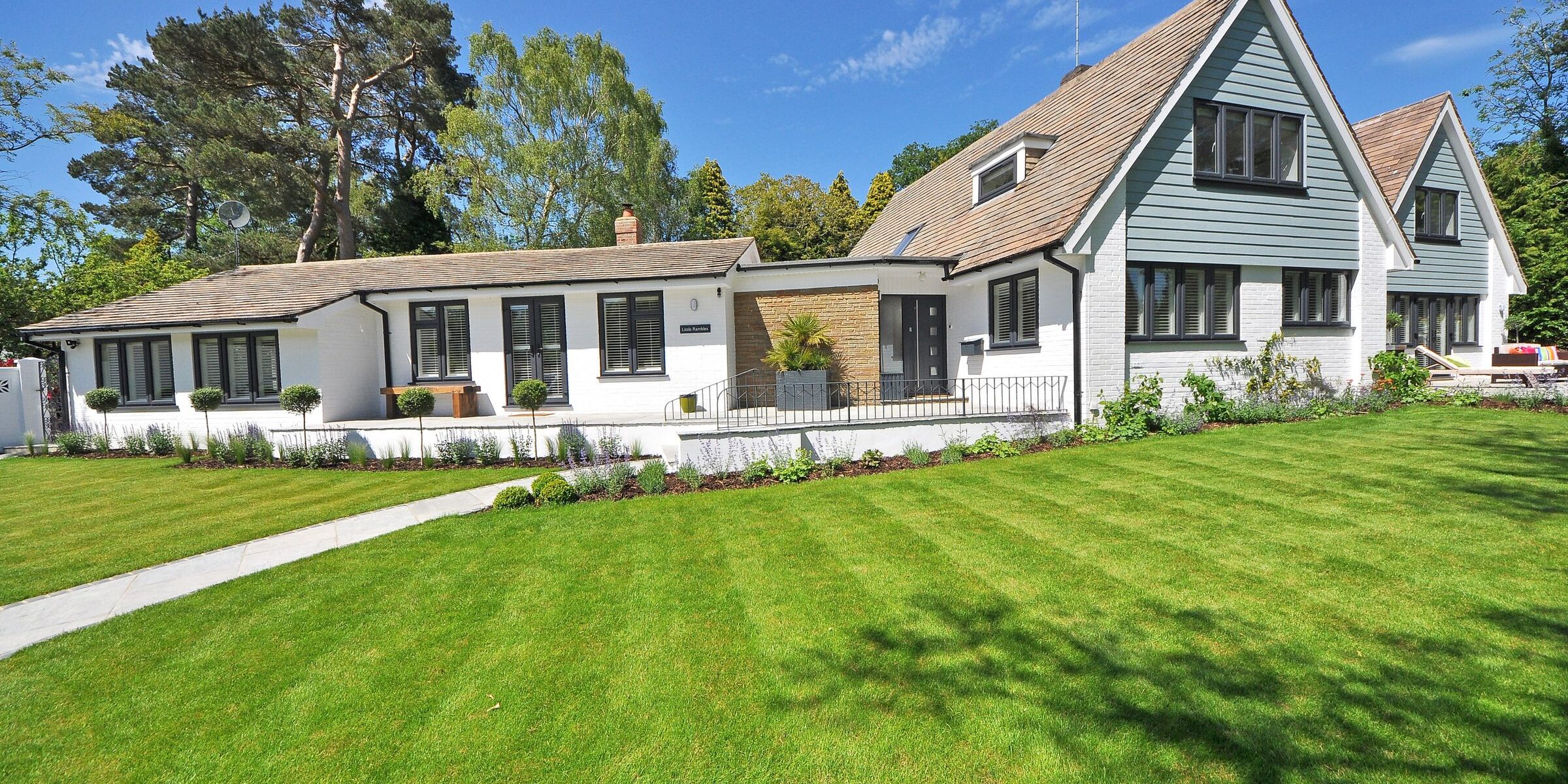 Suburban Cape Cod-style home with green lawn — typical Maryland suburban dwelling