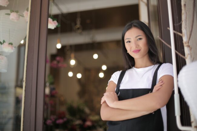 Florida small business owner at her shop entrance