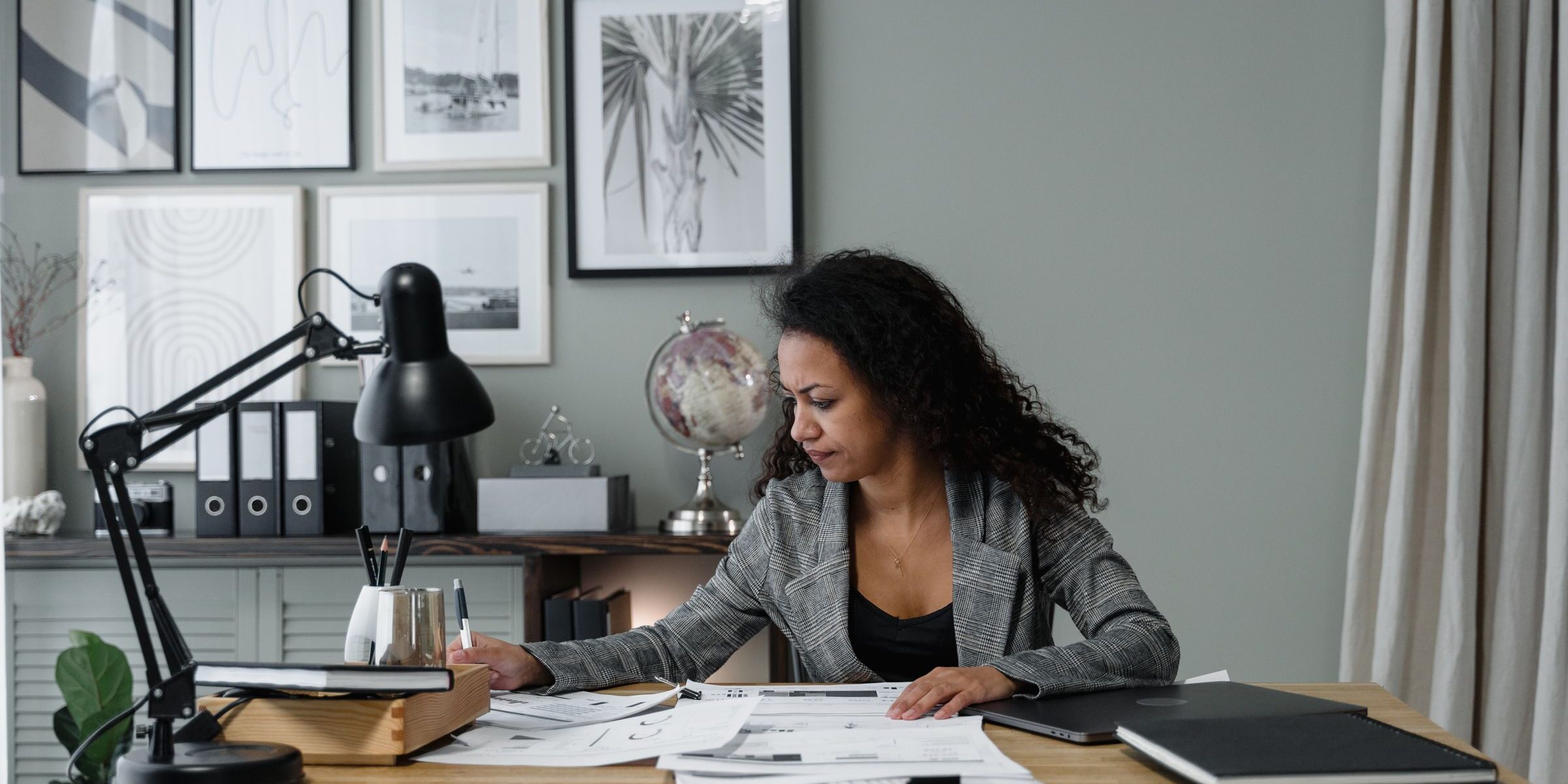 Maryland self-employed professional reviewing documents at a home office desk