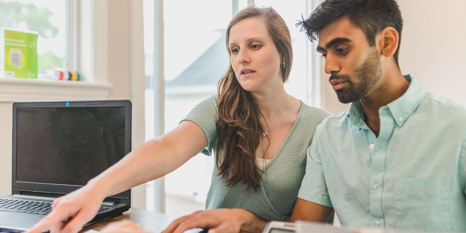 Buyer Strategy Fed Hold July 2026 Young couple reviewing home buying strategy documents with financial advisor, planning smart approach in the current high-rate environment