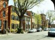 Historic Maryland row houses in Frederick under blossoming trees, representing the distinctive MD residential architecture where homeowners access equity through HELOCs