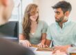 Real estate investor reviewing rental property paperwork representing DSCR loan requirements qualification review