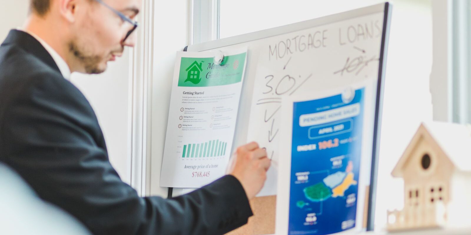 Refinance Timeline Decision Analysis August 2026 Mortgage broker analyzing refinance loan details on a whiteboard, representing the decision framework for homeowners considering refinance timing in August 2026