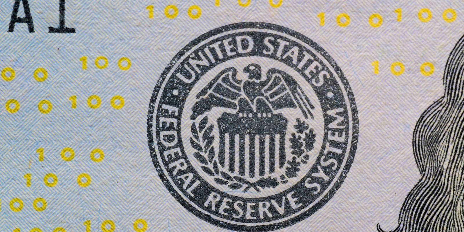 three-fed-dissents-hawkish-hike-risk-2026 US Federal Reserve seal on currency with digital numbers overlay — hawkish dissent hike risk visualization