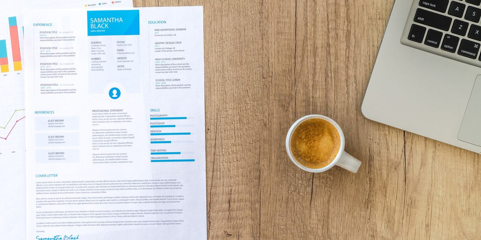 Resume, coffee, and laptop on a desk representing employment history review for mortgage qualification
