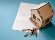 House keys and a mortgage contract on a desk representing pre-approval and underwritten offer letters