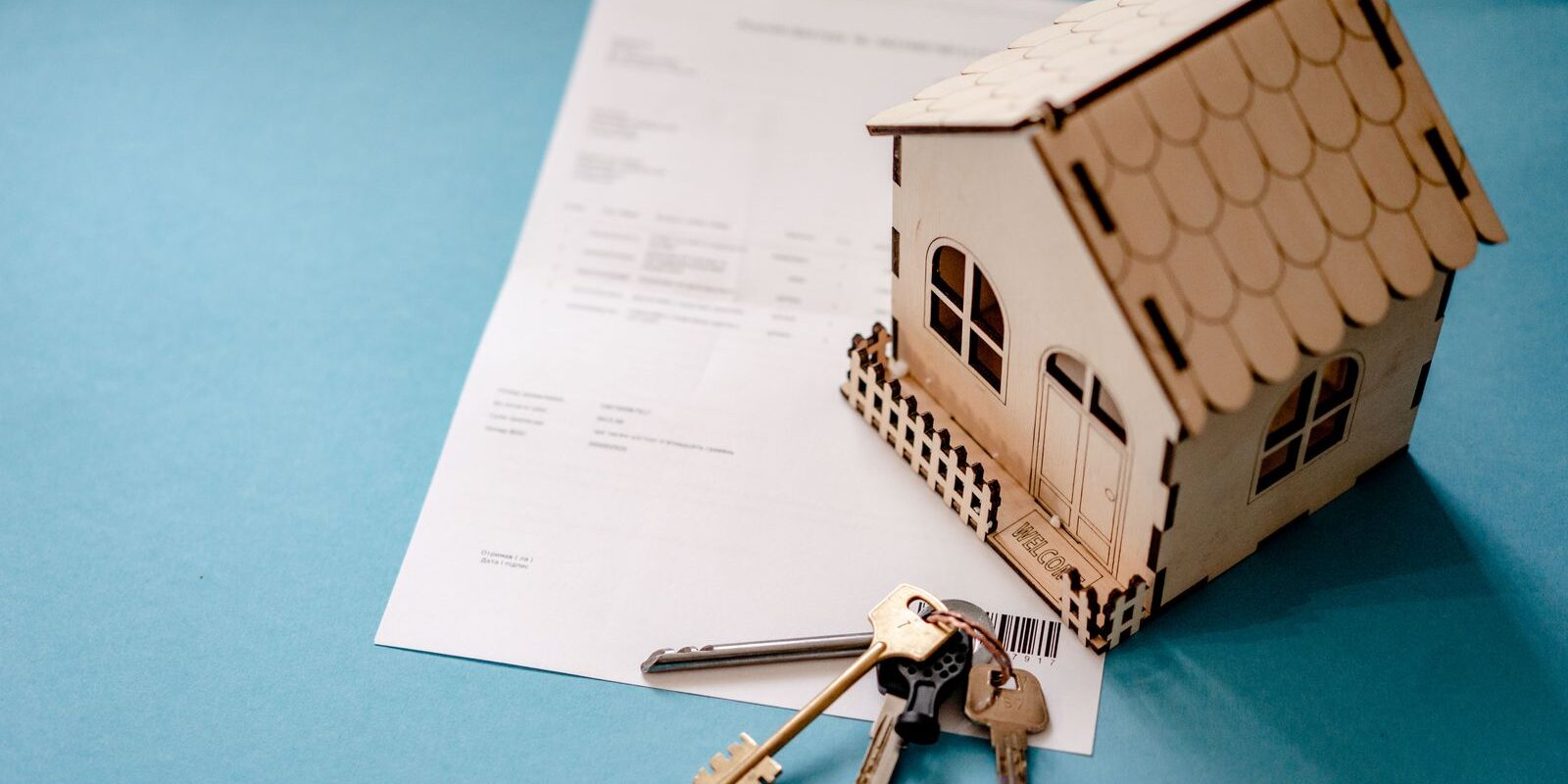 Pre-Qualification vs Pre-Approval vs TBD Underwriting 2026 House keys and a mortgage contract on a desk representing pre-approval and underwritten offer letters