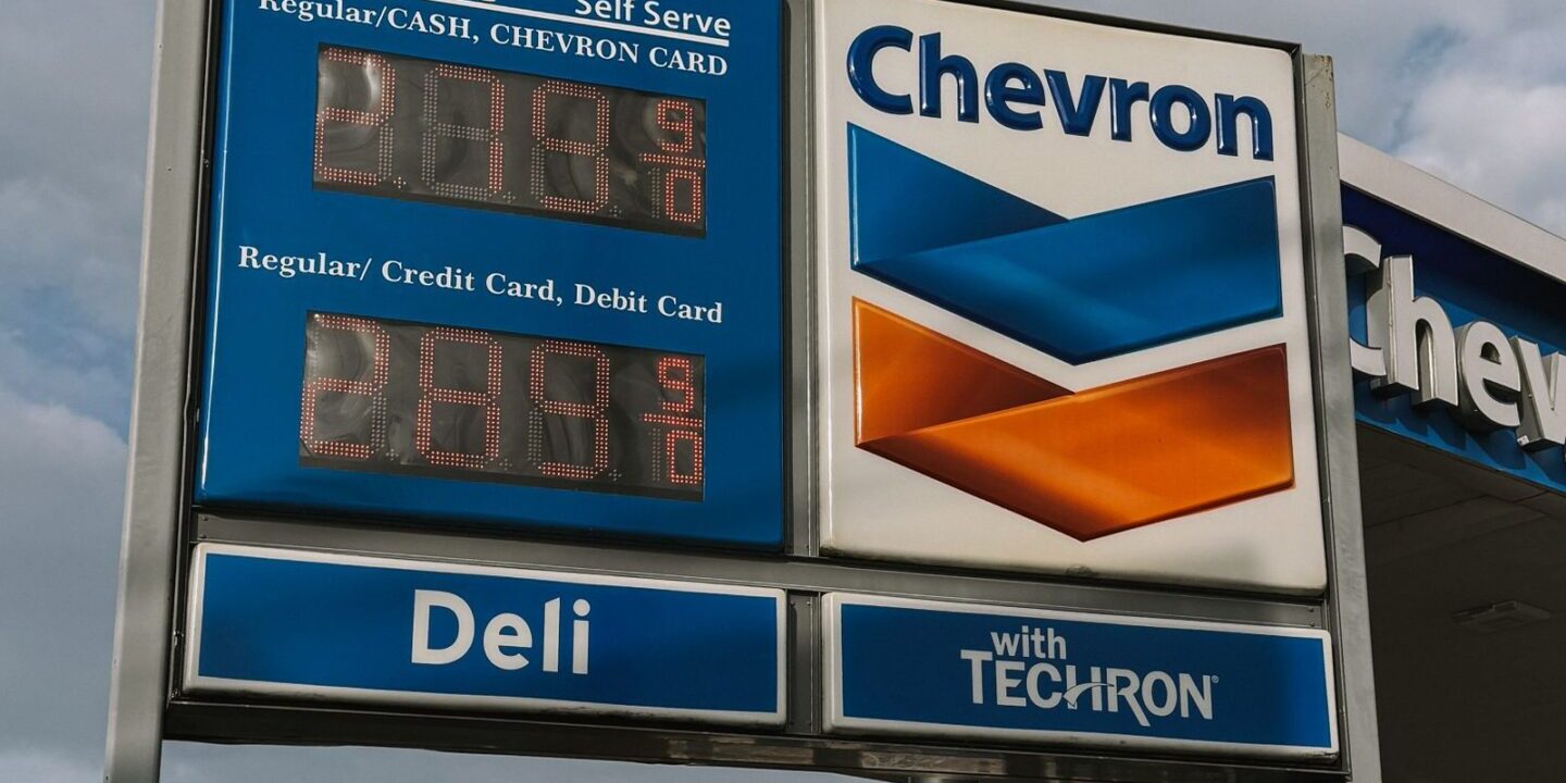 sept-cpi-reaction-us-gas-chevron-2026 Chevron gas station in Houston Texas with price display, representing the 9.1 percent monthly surge in US gasoline prices and 34.2 percent year-over-year rise that drove over half of the September 2026 CPI headline reacceleration to 3.7 percent year-over-year