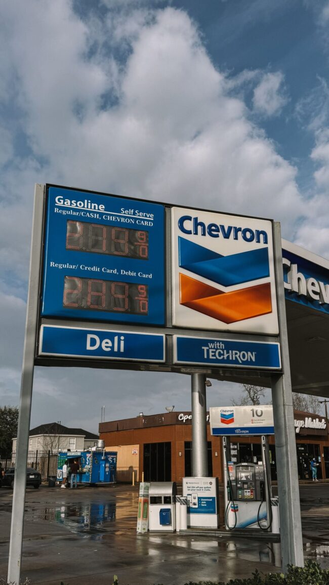 Chevron gas station in Houston Texas with price display, representing the 9.1 percent monthly surge in US gasoline prices and 34.2 percent year-over-year rise that drove over half of the September 2026 CPI headline reacceleration to 3.7 percent year-over-year