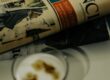 Financial newspaper with coffee cup on desk, representing the news reaction to the September 2026 BLS Employment Situation Report cold print and downward revisions and what the dovish labor market surprise means for mortgage rates