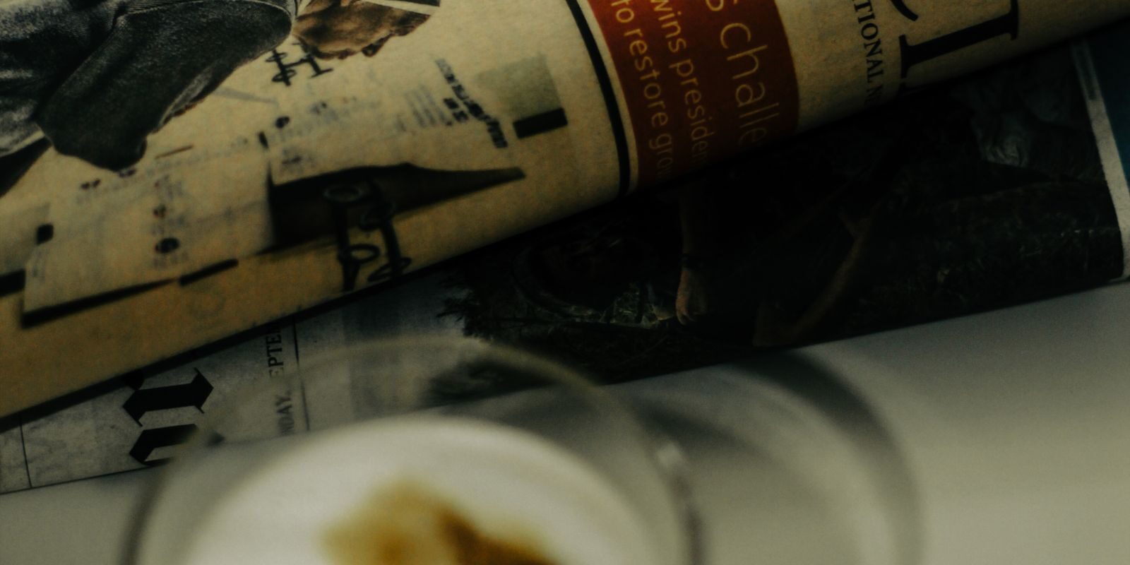 sept-jobs-reaction-2026 Financial newspaper with coffee cup on desk, representing the news reaction to the September 2026 BLS Employment Situation Report cold print and downward revisions and what the dovish labor market surprise means for mortgage rates