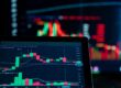 Close-up of a financial trading screen displaying bond market charts and data visualization, representing the Treasury yield and mortgage-backed securities spread divergence that explains why mortgage rates can rise even after a weak jobs report