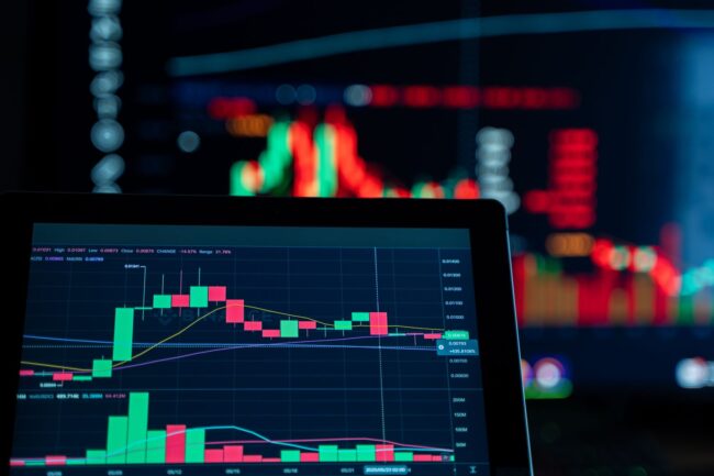 Close-up of a financial trading screen displaying bond market charts and data visualization, representing the Treasury yield and mortgage-backed securities spread divergence that explains why mortgage rates can rise even after a weak jobs report